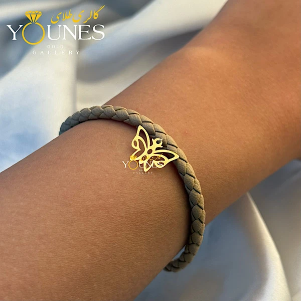 دستبند چرم کرمی پروانه لیزری طلا